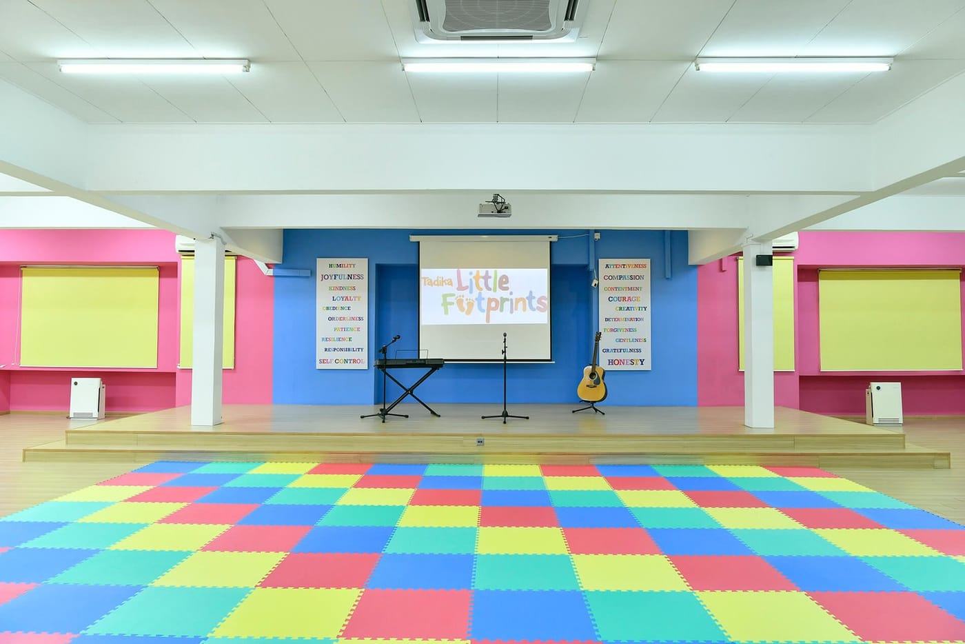 Assembly hall stage with keyboard and guitar